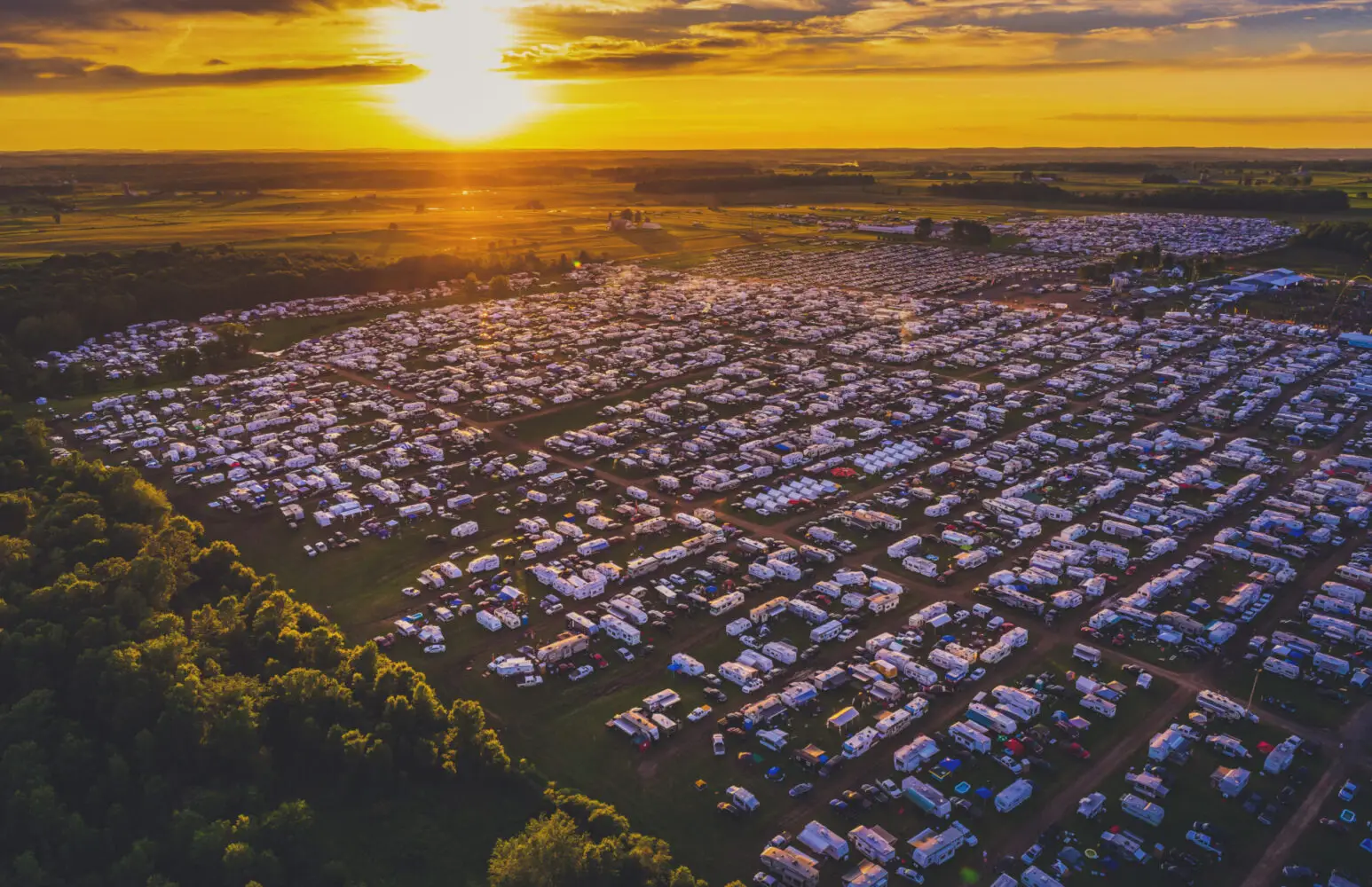 An aerial view of a large field with many tents.